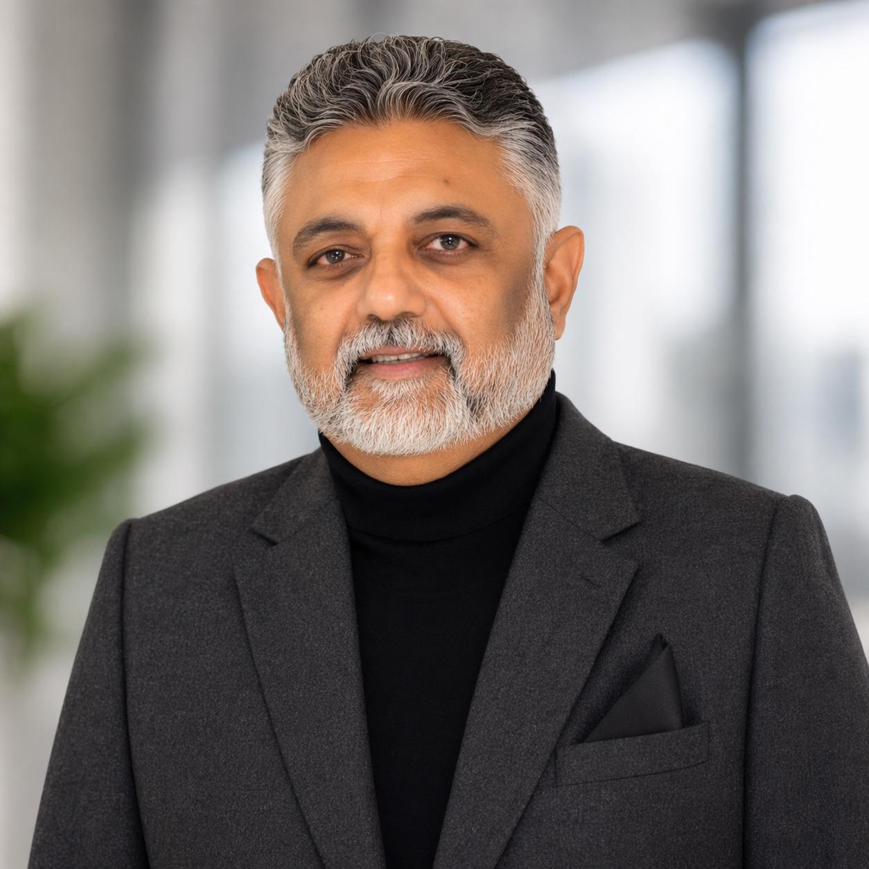 Man in a Blue Blazer with a Beard and Short Hair